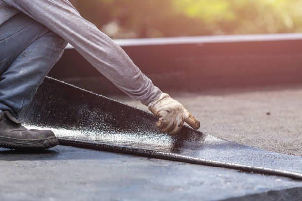Professional Waterproofing technician working in Elba, NY
